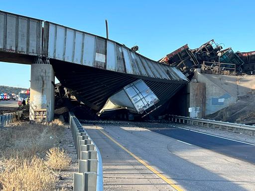 Semi-truck driver killed when Colorado train derails, spilling train cars and coal onto a highway
